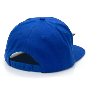 Detail of royal blue snapback hat featuring silver cone studs and plastic back strap