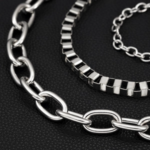 Close-up of three layered silver hip-hop pants chains with polished heavy industrial links