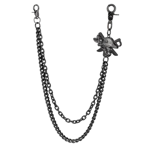 Detail of gunmetal punk trousers chain featuring a rhinestone-set pirate skull pendant
