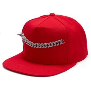 Red snapback hat with silver cuban link chain and metal spike in hip hop style