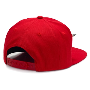 Detail view of red hip-hop flat brim hat with silver spikes and snapback closure