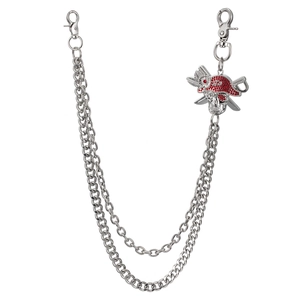 Detail of silver double-layered hip-hop pant chain with red rhinestone skull charm