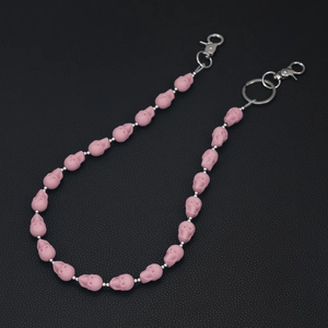 Pink matte skull beads on a silver chain with lobster clasps on black leather