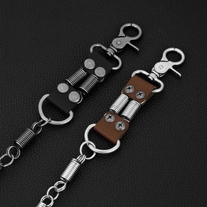 Close-up of vintage leather keychain with heavy-duty metal dual springs and lobster clasps