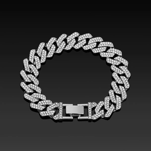Detailed macro view of silver Cuban link bracelet with sparkling pave diamonds and box clasp