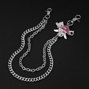 Detail of silver double-layered hip-hop pants chain with a red rhinestone pirate skull