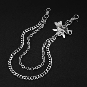 Detail of silver pirate skull and crossed swords pendant on hip-hop double layer waist chain