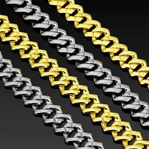 Detailed macro view of 14mm gold and silver polished Cuban link chains for men