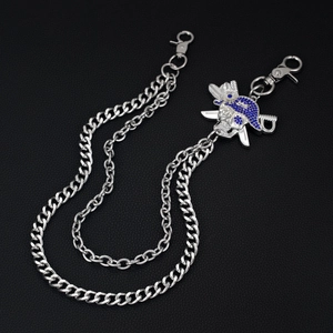 Detail of silver dual-layer hip hop chain with jeweled skull and cross swords pendant