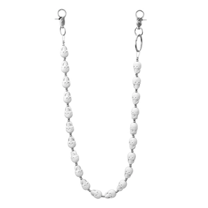 Detail of white resin skull beads on a hip hop trouser chain with silver lobster clasps