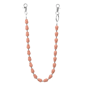 Detailed close-up of light pink skull beads and silver metal lobster clasps on a pant chain
