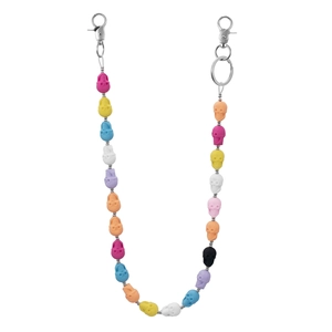 Close-up of colorful resin skull beads with metal lobster clasps and key ring
