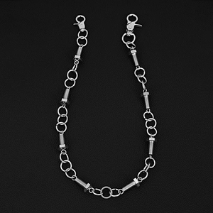 Close-up of industrial punk style trouser chain with bolt links and silver lobster clasps
