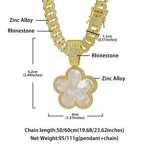 Macro view of gold Cuban chain with dimensions and shell petal pendant detail