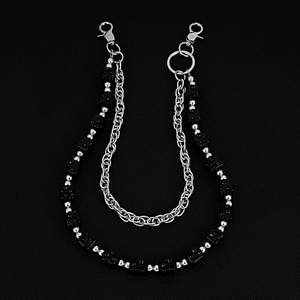 Close-up of double-layered hip-hop pant chain with black dice beads on leather