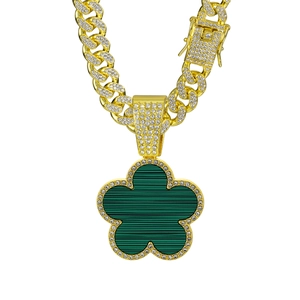 Hip hop style gold Cuban chain necklace with green clover pendant and white zircons