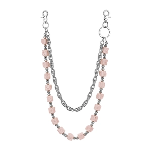 Detail of pink cheese-style cube beads on a double-layer silver metal pants chain