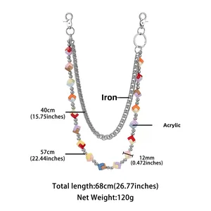 Detail view of double-layered metal waist chain with colorful acrylic cube dice charms