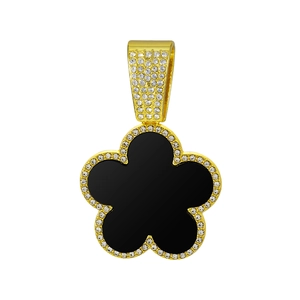 Detailed close-up of a golden four-leaf clover pendant with black enamel and zircon inlay