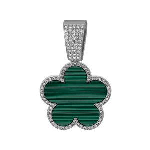 Detailed macro view of the silver flower pendant with green stripes and cubic zirconia