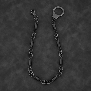 Detail shot of industrial punk metal pants chain with hex nuts and lobster clasp on leather
