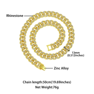Macro view of 13mm gold plated Cuban chain necklace with sparkling white rhinestones