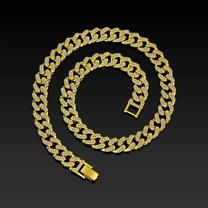 Macro shot of 13mm gold plated iced out Cuban chain with micro paved rhinestones