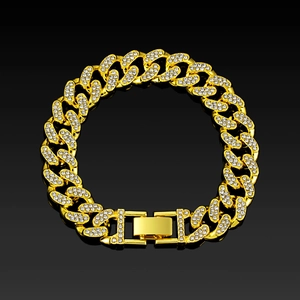 Macro detail of 13mm gold plated Cuban chain bracelet with iced out crystals