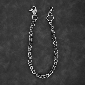 Industrial silver nut link wallet chain with skull clasp on grey leather background