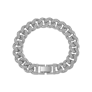 Macro shot of silver-colored iced out Cuban link bracelet with high-quality pavé rhinestones