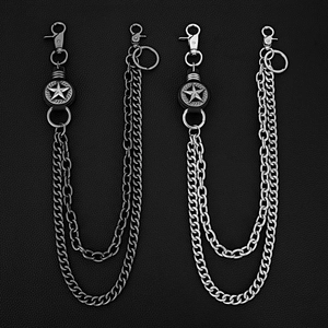 Detail of double-layer metal pant chains with star pendants in silver and antique finish