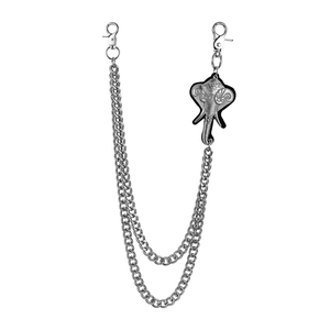 Detail of double-layer curb chain with vintage elephant head pendant and metal clasps