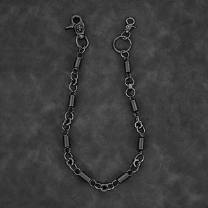 Detail of vintage hip-hop metal trouser chain with skull relief and snap hooks