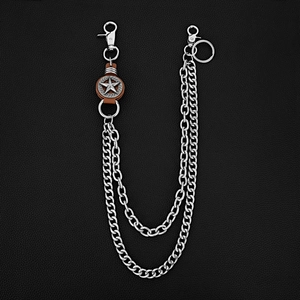 Detailed close-up of punk double layer metal trousers chain with star leather accent