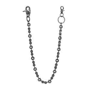 Detail of gunmetal skull wallet chain with bicycle links and hexagonal nut hardware