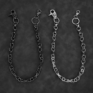 Detail of heavy metal skull wallet chains in gunmetal and silver biker style