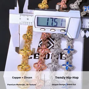 Digital caliper measuring 17.51mm width of a hip hop clover necklace in copper and zircon