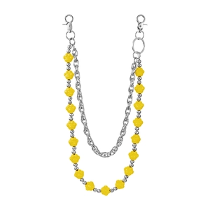 Detailed view of dual-layer pants chain with yellow bear paw charms and metal links