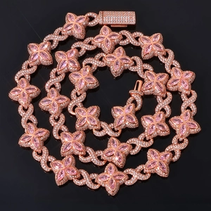 Macro detail of rose gold clover necklace with pink marquise stones and white cubic zirconia