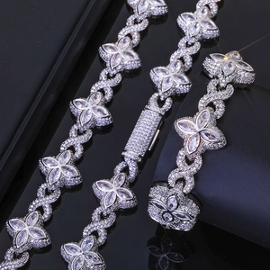 Macro detail of silver four-leaf clover bracelet with marquise-cut cubic zirconia stones