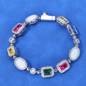 Macro shot of S925 silver bracelet featuring colorful gemstones and oval opal stones
