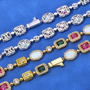 Parure de bracelets hip hop sertis de zircons colorés et d'opales en finition or et argent