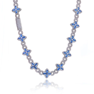 Luxury hip hop clover necklace featuring blue marquise stones and crystal infinity links