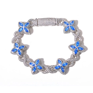 Macro shot of silver hip hop bracelet with blue marquise stones and infinity links