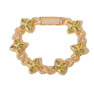 Luxury Cuban link bracelet with green clover stones and gold-plated zircon details