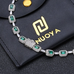 Luxury silver bracelet featuring emerald cut green zircon and micro-paved white crystals