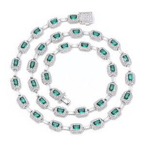 Luxurious emerald-cut green gemstone necklace with white halo pavé and silver link chain