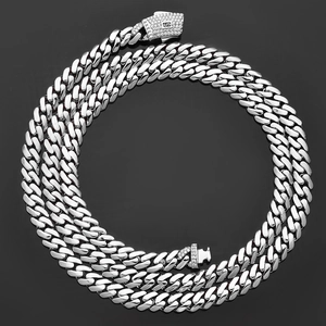 Detail of silver Cuban link chain featuring a sparkling diamond clasp and S engraving