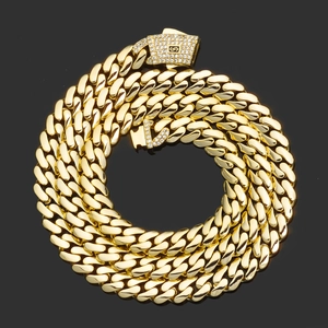 Detailed close-up of 14K gold Cuban link chain with iced out pavé diamond clasp detail