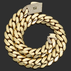 Detail view of 14K gold plated Cuban link chain with iced out buckle and S logo
